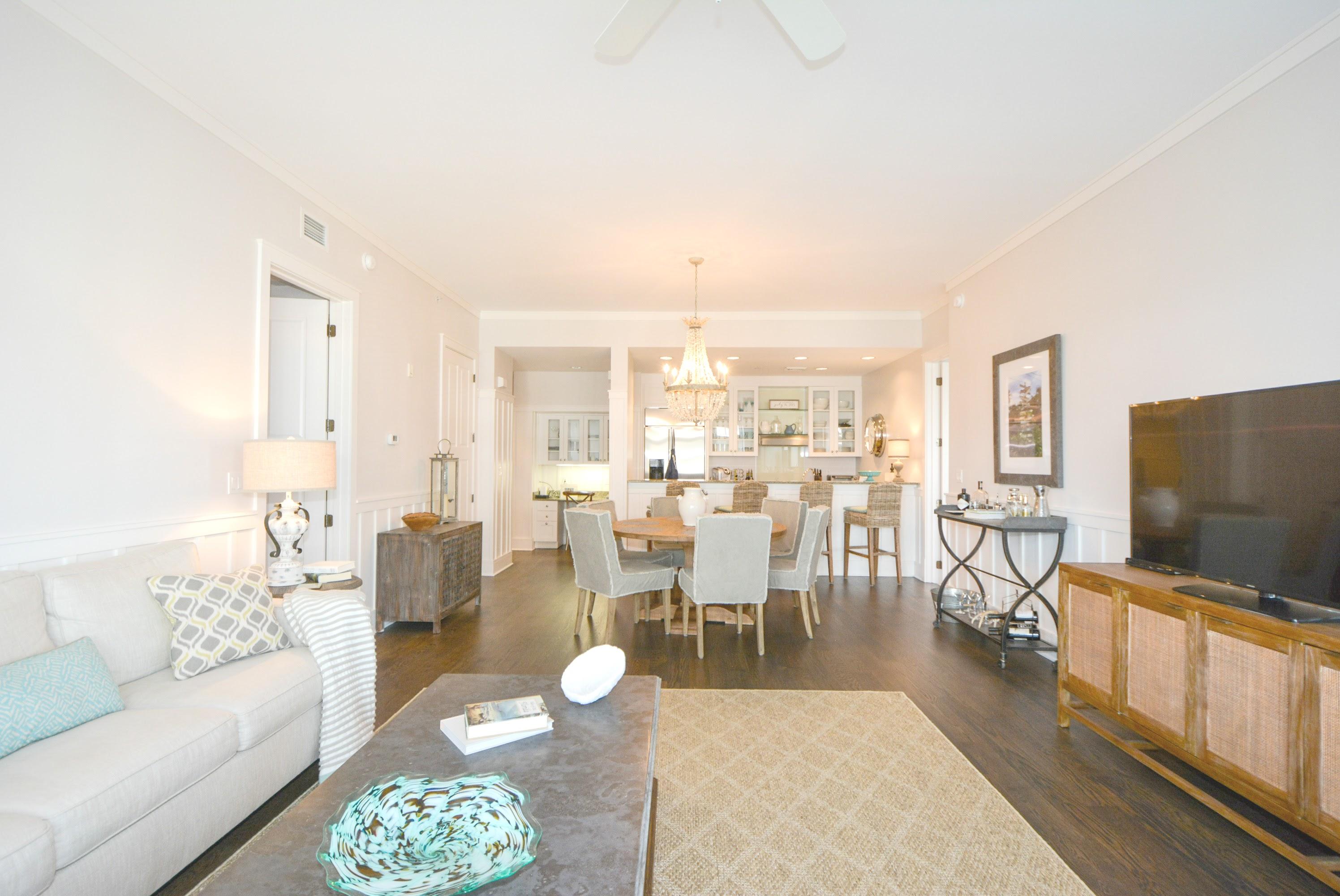 99 Compass Point Way South, Unit 201 Inlet Beach, FL 32461 - Photo 6 of 56 a living room with furniture a rug and a flat screen tv