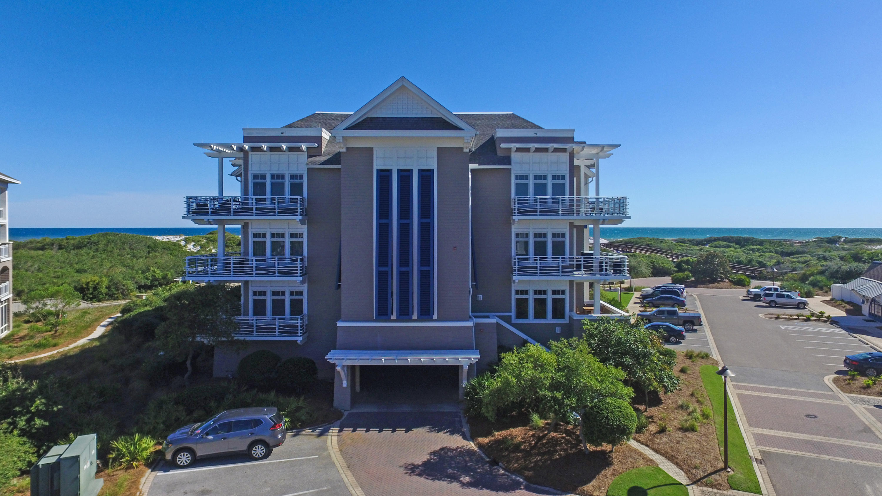 99 Compass Point Way South, Unit 201 Inlet Beach, FL 32461 - Photo 54 of 56 a front view of a house with a yard