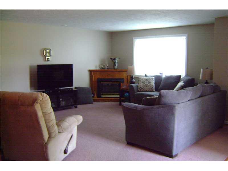959 Harper Road Crescent, PA 15046 - Photo 10 of 24 Living Room. Spacious living room opens to kitchen and dining room has a cozy corner gas fireplace.