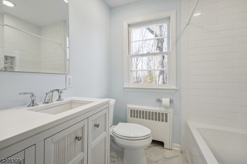 37 Evergreen Road Summit, NJ 07901 - Photo 11 of 28 a bathroom with a sink a toilet and bathtub