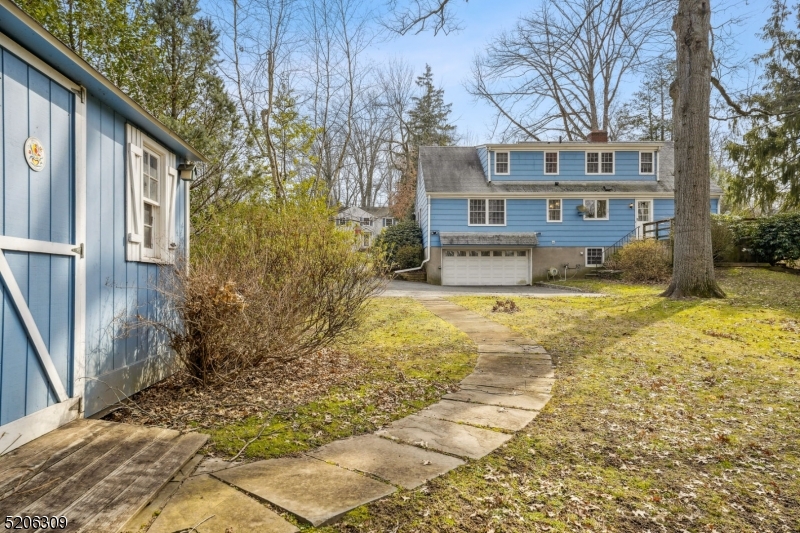 37 Evergreen Road Summit, NJ 07901 - Photo 25 of 28 a front view of house with yard and trees around