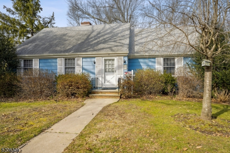 37 Evergreen Road Summit, NJ 07901 - Photo 28 of 28 a front view of house with yard and trees around