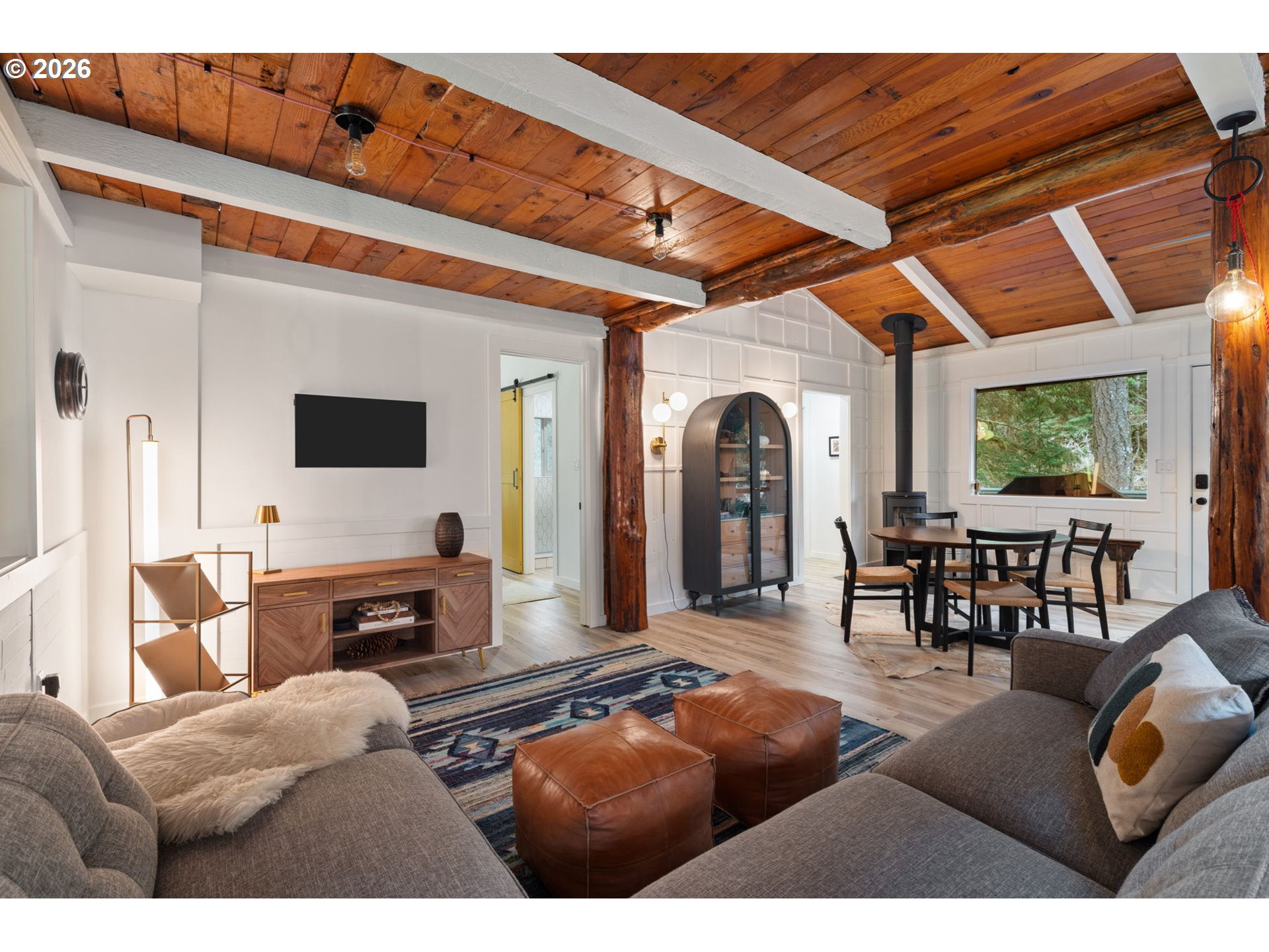 110 Wooden Bridge Road Kalama, WA 98625 - Photo 12 of 48 a living room with furniture a flat screen tv and a large window