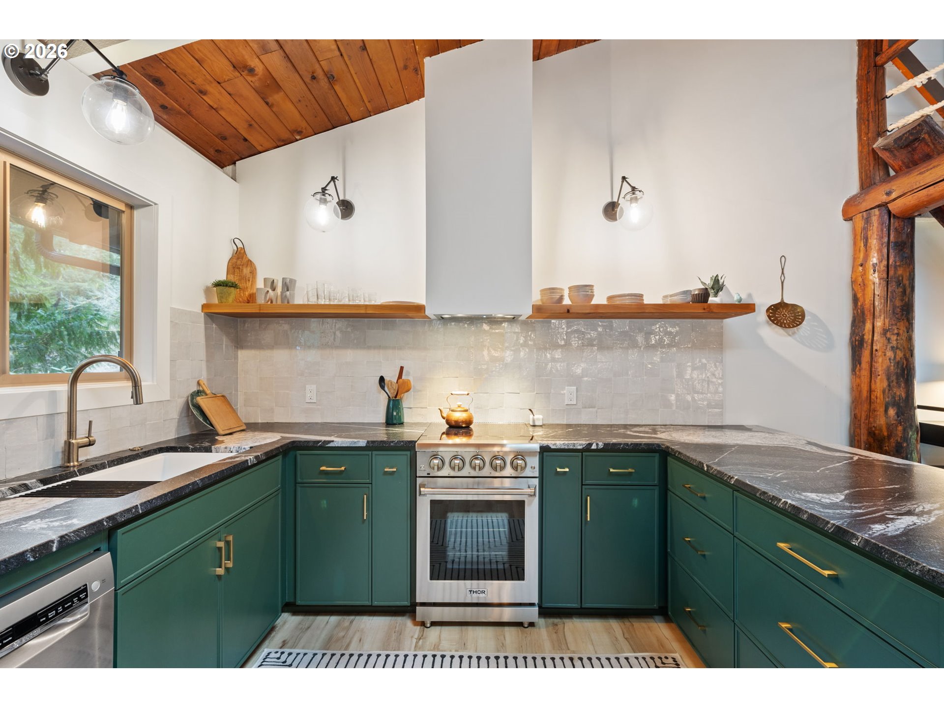 110 Wooden Bridge Road Kalama, WA 98625 - Photo 13 of 48 a kitchen with a sink and cabinets