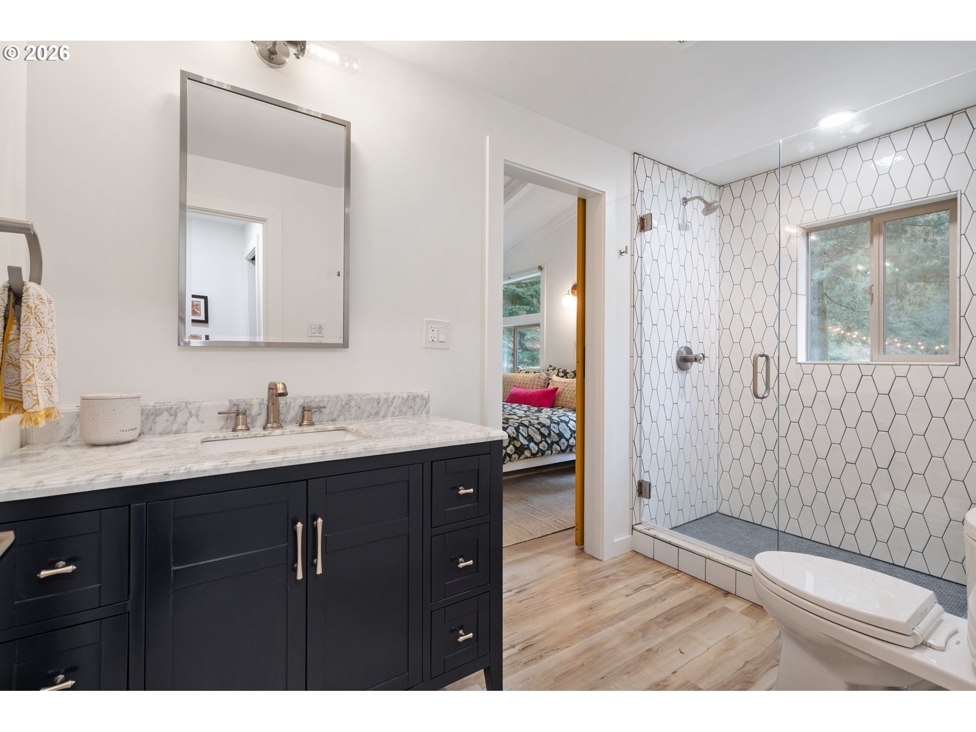110 Wooden Bridge Road Kalama, WA 98625 - Photo 22 of 48 a bathroom with a granite countertop sink a mirror and a shower