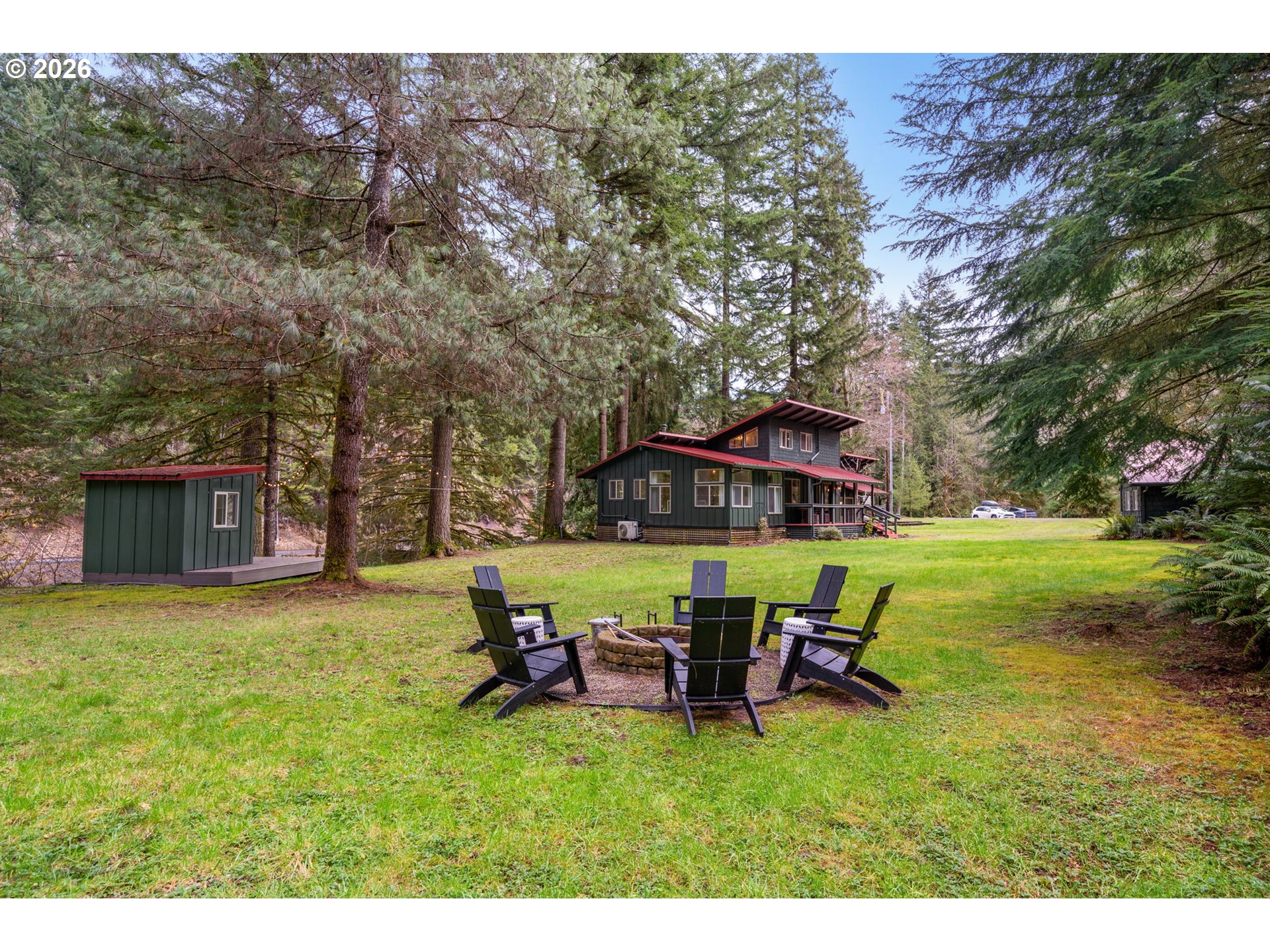 110 Wooden Bridge Road Kalama, WA 98625 - Photo 41 of 48 a view of a house with backyard porch and sitting area