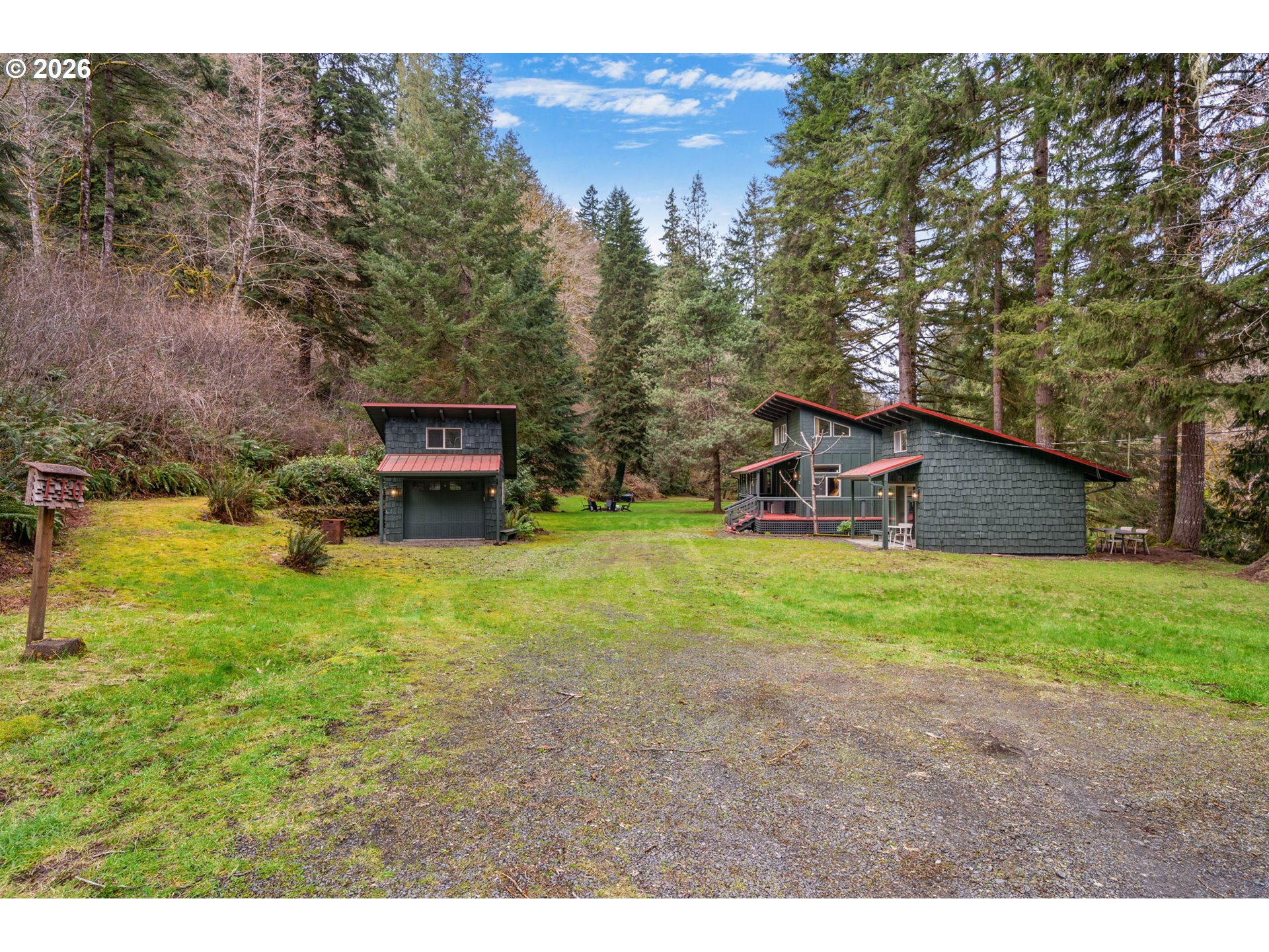 110 Wooden Bridge Road Kalama, WA 98625 - Photo 42 of 48 a house view with a sitting space and garden