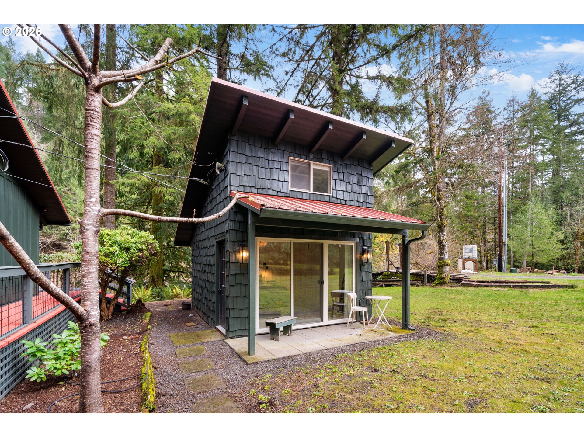 110 Wooden Bridge Road Kalama, WA 98625 - Photo 5 of 48 a backyard of a house with table and chairs