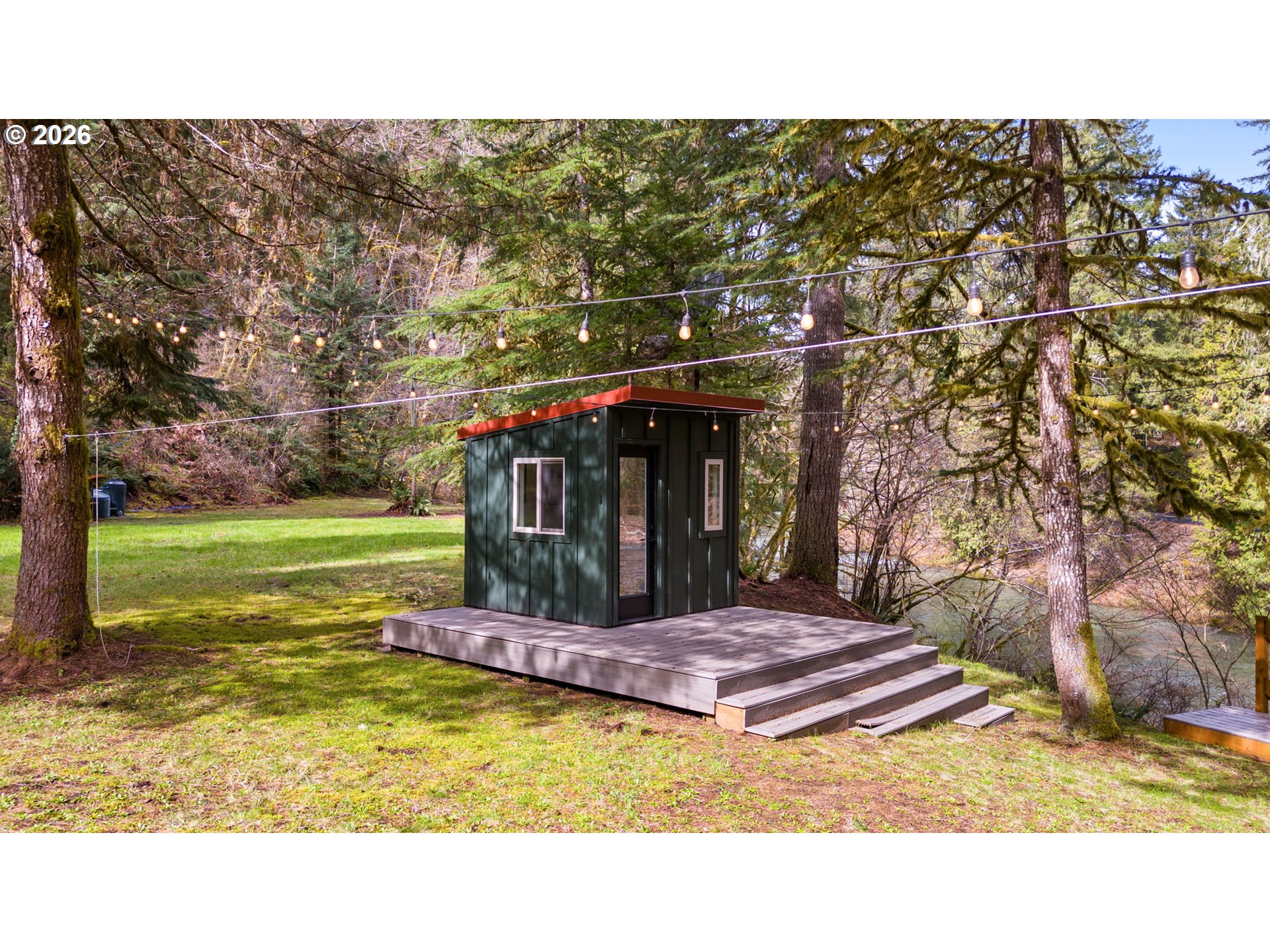 110 Wooden Bridge Road Kalama, WA 98625 - Photo 7 of 48 a balcony with a table and chairs