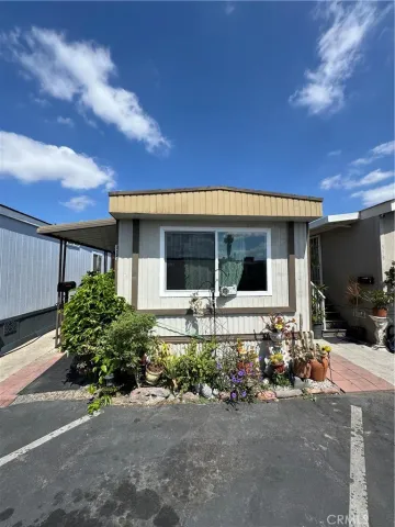 a front view of a house with sitting area