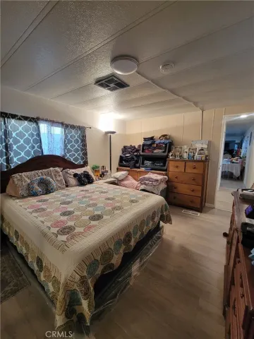 a bedroom with a bed and furniture