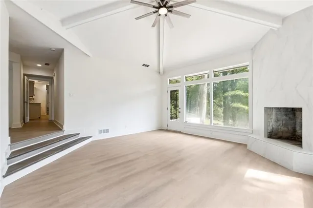 a view of an empty room with a window