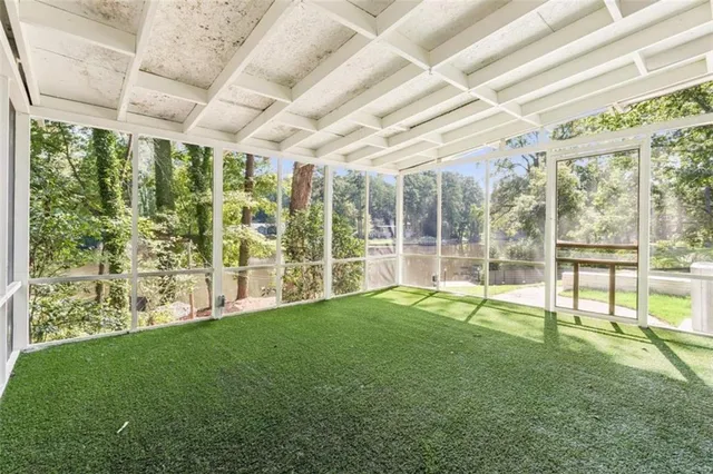 a large room with lots of green space