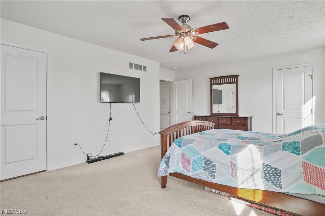 4169 Whitestone Road Kent, OH 44240 - Photo 19 of 33 Carpeted bedroom with ceiling fan