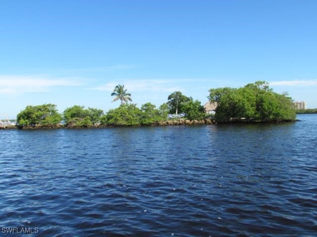 Little Shell Island Fort Myers, FL 33908 - Photo 12 of 26 a view of a lake with houses in the back