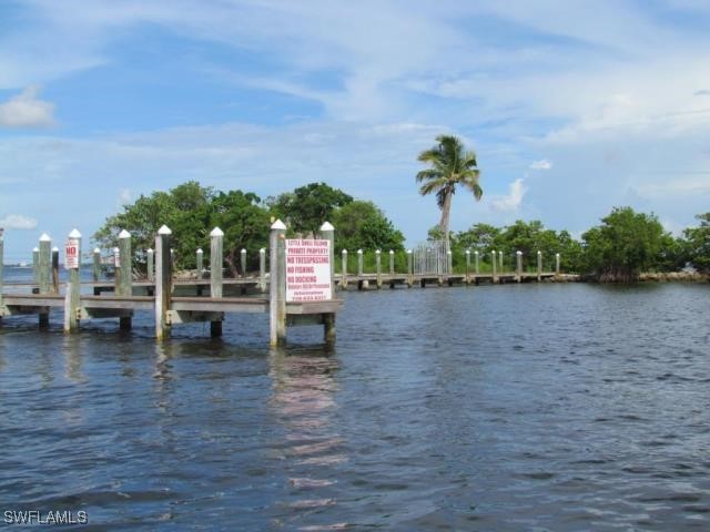 Little Shell Island Fort Myers, FL 33908 - Photo 15 of 26 a view of a lake with houses in the back