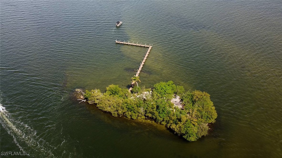 Little Shell Island Fort Myers, FL 33908 - Photo 8 of 26 a bathroom with a toilet sink