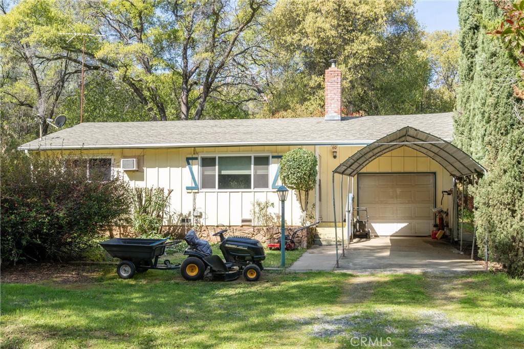 a view of a house with backyard porch and sitting area