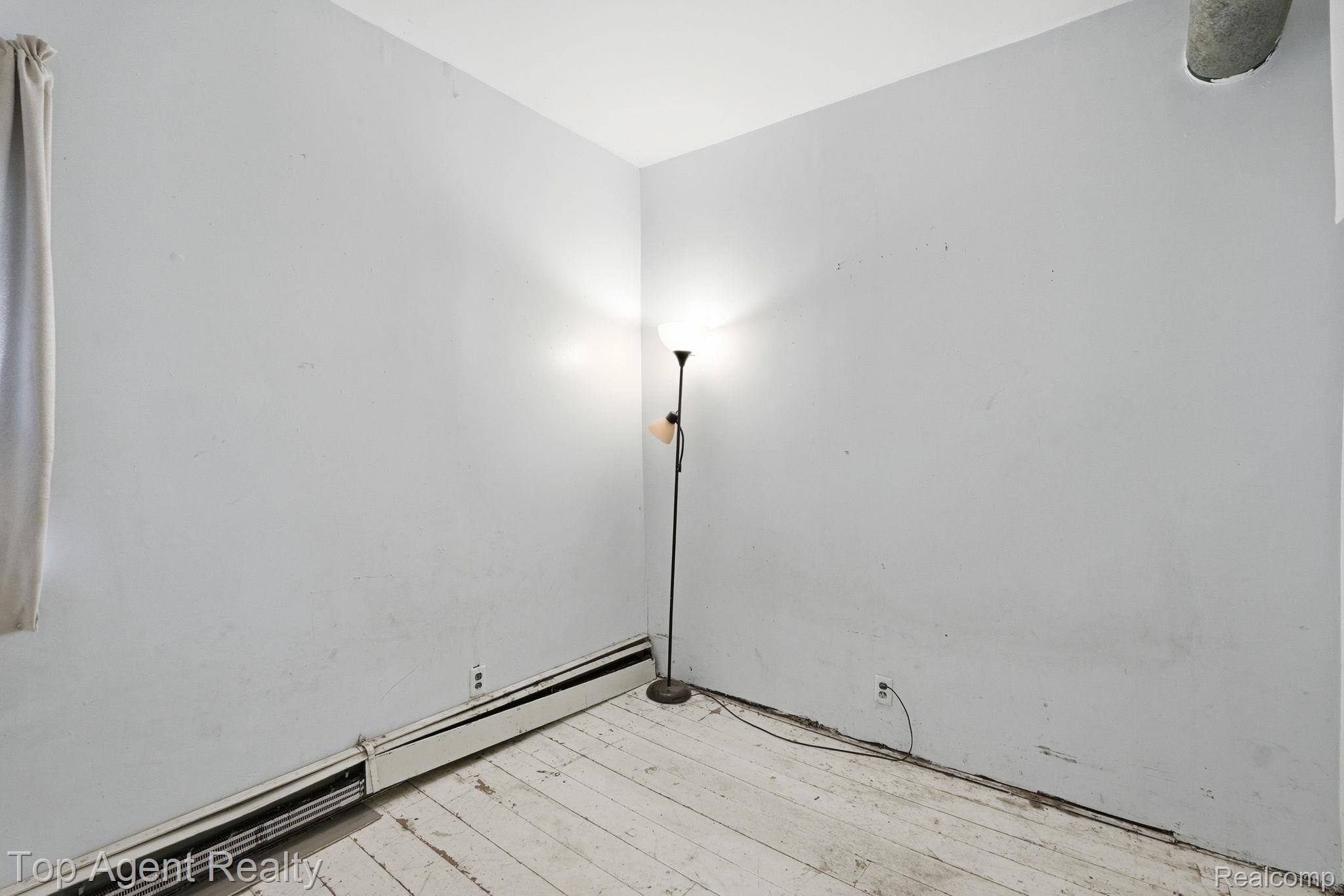 95 West Lapeer Road Peck, MI 48466 - Photo 24 of 33 Spare room with light wood-type flooring and baseboard heating