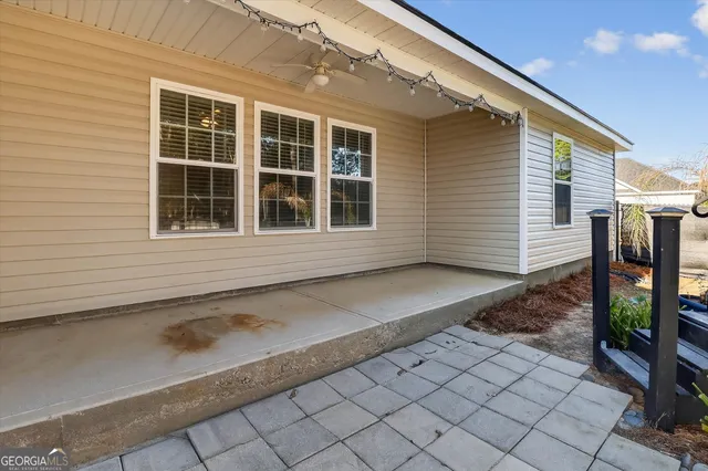 a view of a yard with basketball court
