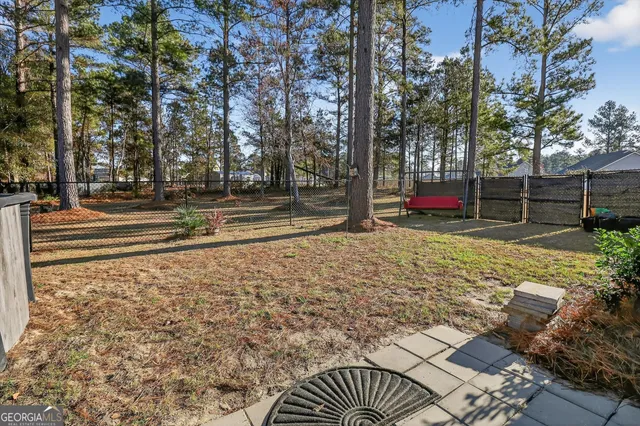 a view of a street with a building in the background