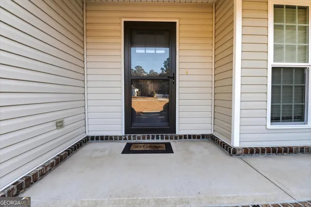 a view of a door and a window