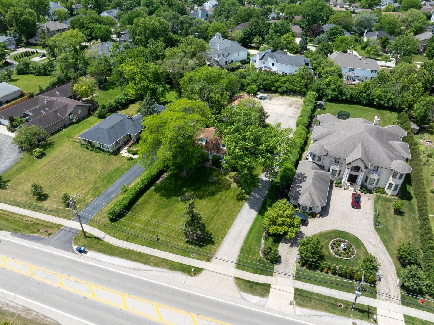 1450 Sanders Road Northbrook, IL 60062 - Photo 7 of 8 an aerial view of residential house with outdoor space and parking