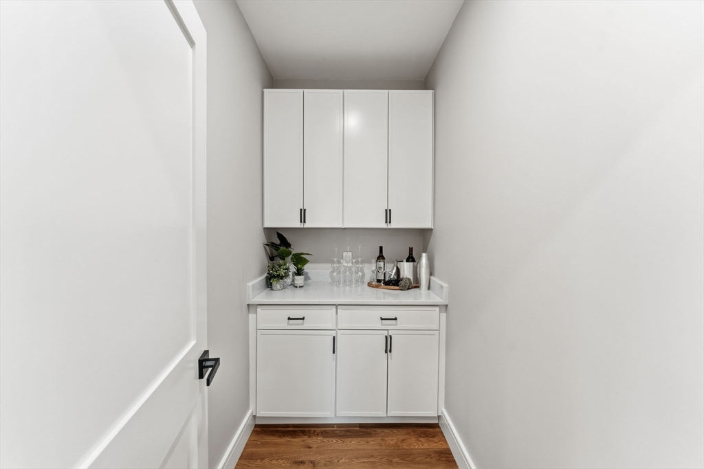 143 Hunting Road Needham, MA 02494 - Photo 15 of 42 a view of cabinets and wooden floor