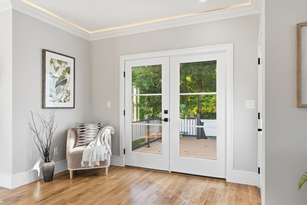143 Hunting Road Needham, MA 02494 - Photo 18 of 42 a living room with furniture and a window