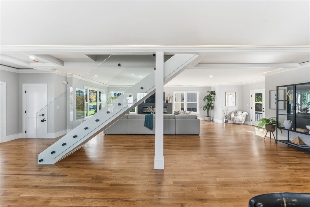 143 Hunting Road Needham, MA 02494 - Photo 19 of 42 a view of entryway and hall with wooden floor