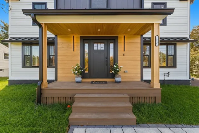 a front view of a house with garden