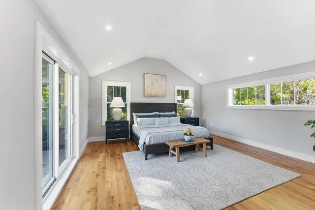 a bedroom with furniture and a window