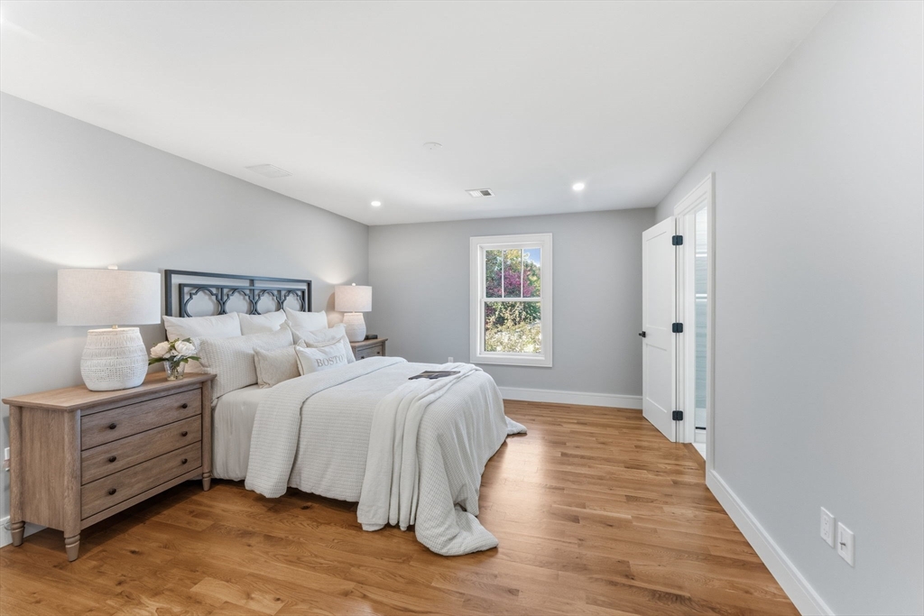 143 Hunting Road Needham, MA 02494 - Photo 28 of 42 a bedroom with a bed and a window