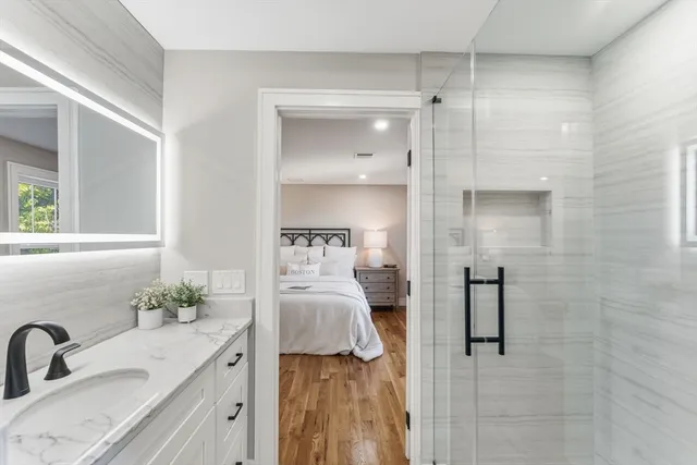 a bedroom with a bed and a bathroom