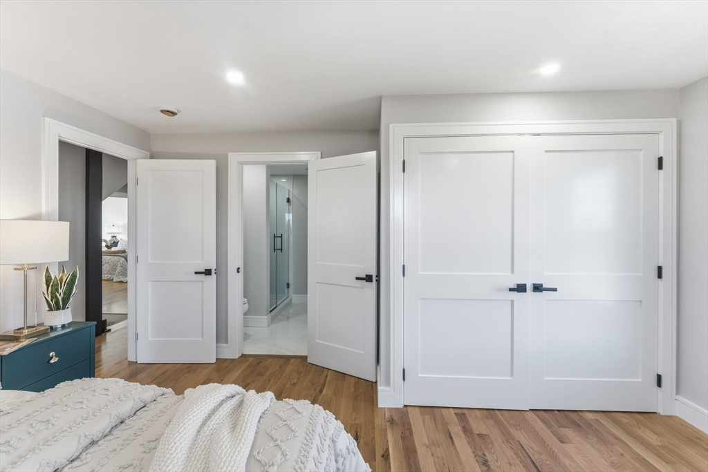 143 Hunting Road Needham, MA 02494 - Photo 30 of 42 a bedroom with a bed and a bathroom