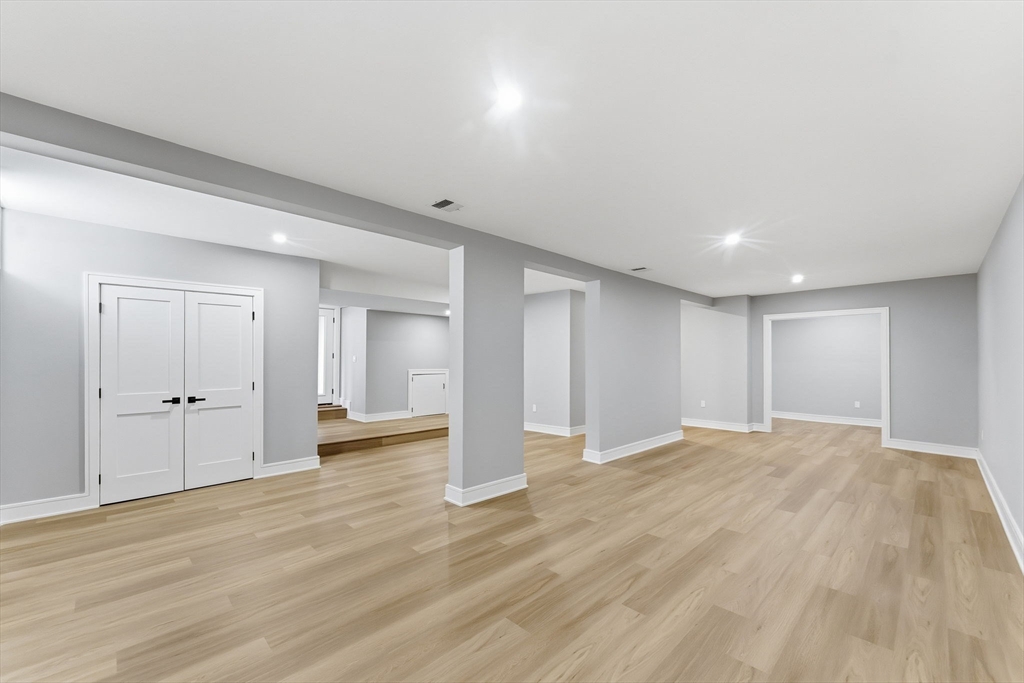 143 Hunting Road Needham, MA 02494 - Photo 37 of 42 a view of an empty room with wooden floor and closet