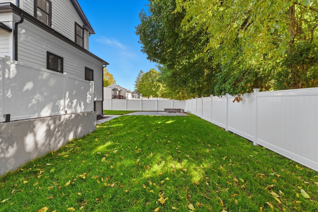 143 Hunting Road Needham, MA 02494 - Photo 42 of 42 a view of yard with small cabin and wooden fence