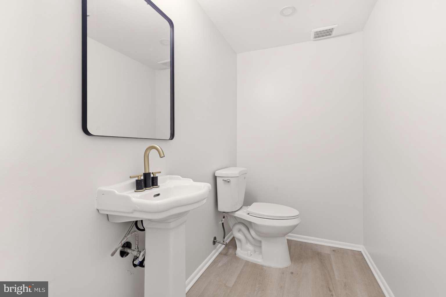 804 Mason Run Pine Hill, NJ 08021 - Photo 6 of 15 a bathroom with a sink toilet and mirror