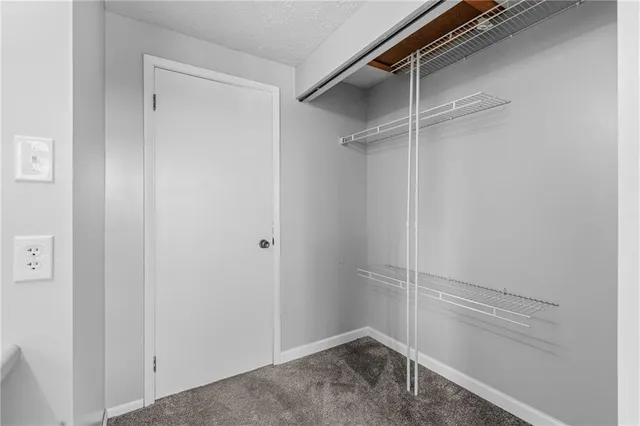a view of an empty walk in closet