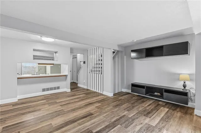 a view of a bedroom with furniture and cabinet