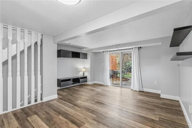 a view of a livingroom with wooden floor