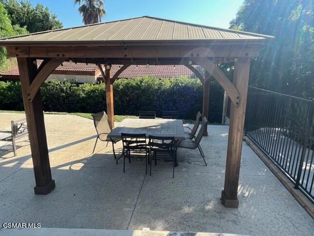 279 North Skyline Drive Thousand Oaks, CA 91362 - Photo 22 of 24 an outdoor sitting area with furniture and umbrella