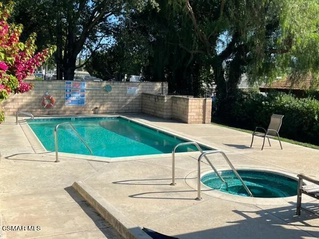 a view of a swimming pool with a patio