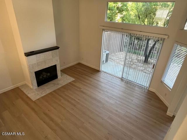279 North Skyline Drive Thousand Oaks, CA 91362 - Photo 7 of 24 a view of a livingroom with wooden floor and a fireplace