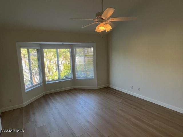 279 North Skyline Drive Thousand Oaks, CA 91362 - Photo 9 of 24 an empty room with wooden floor and windows