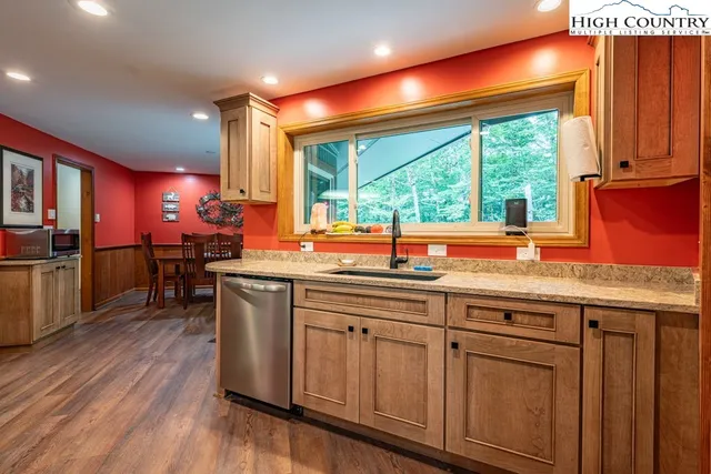 a kitchen with lots of counter space and a large window