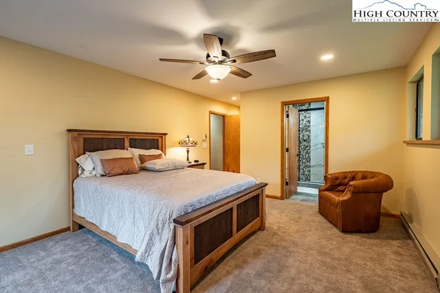 a bed room with a bed and a chandelier