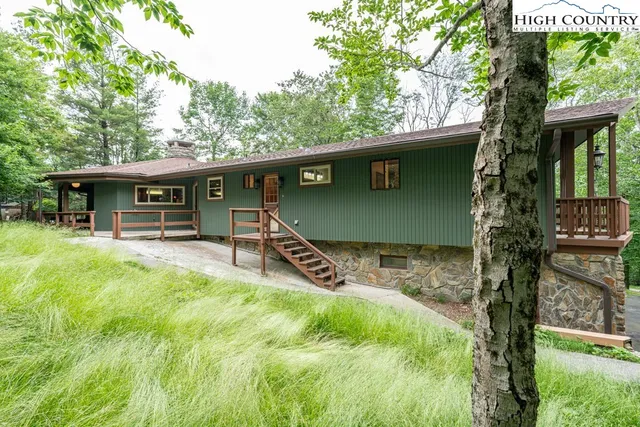 aerial view of a house with table and chairs