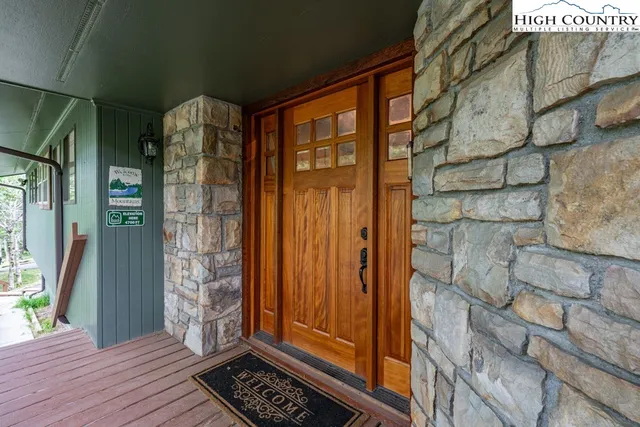 a view of a entryway door with wooden floor