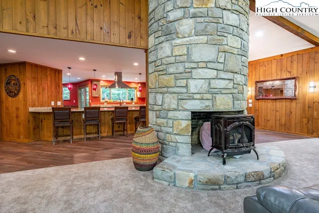 a kitchen with stainless steel appliances kitchen island granite countertop a stove and cabinets